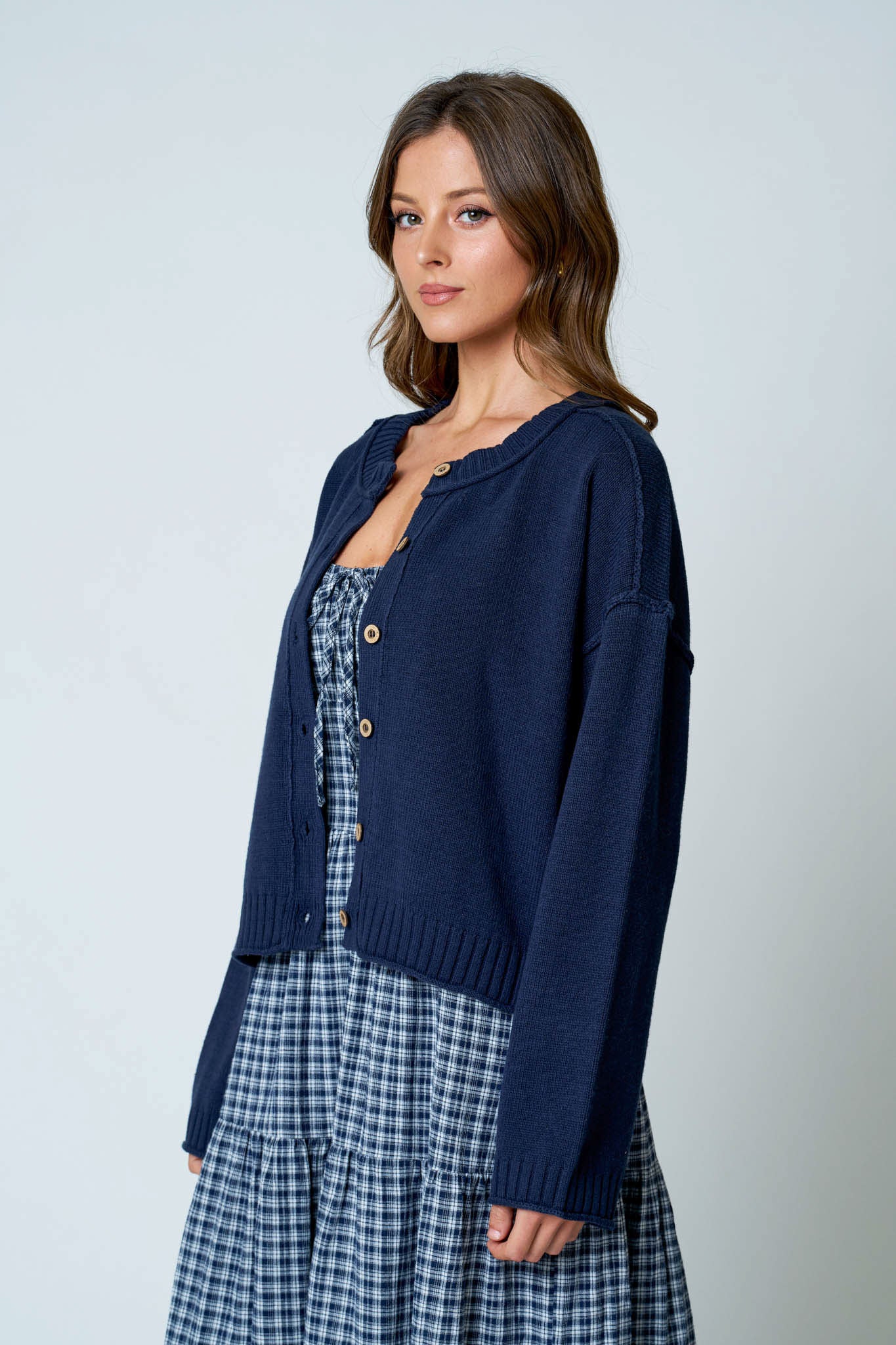 RAW EDGE EXPOSED SEAM BUTTON DOWN KNIT CARDIGAN