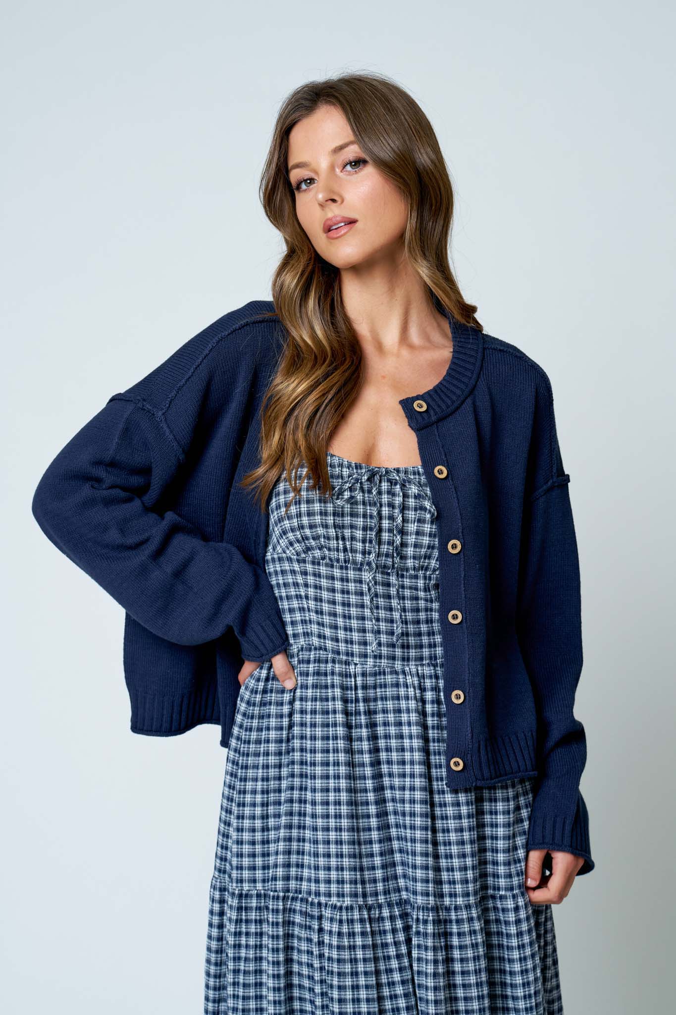 RAW EDGE EXPOSED SEAM BUTTON DOWN KNIT CARDIGAN