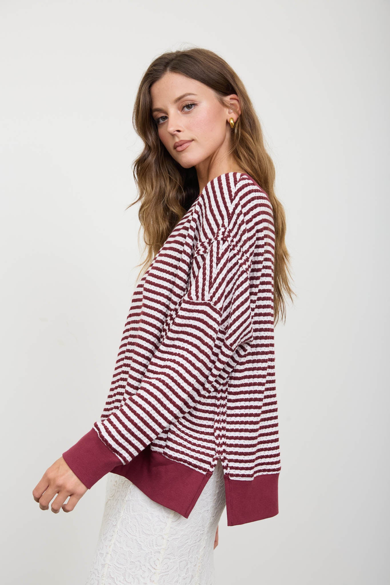 STRIPE EXPOSED SEAM SPLIT HEM LONG SLEEVE KNIT TOP (PRE-ORDER)